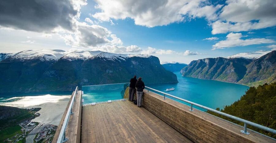 Bergen: Nærøyfjorden, Flåm, and Stegastein Guided Bus Tour - Stegastein viewpoint: the cliff angles 650 meters over the fjord