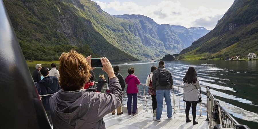 Bergen: Nærøyfjorden, Flåm, and Stegastein Guided Bus Tour - Gudvangen sightseeing: the palate cleanser before the fjord cruise