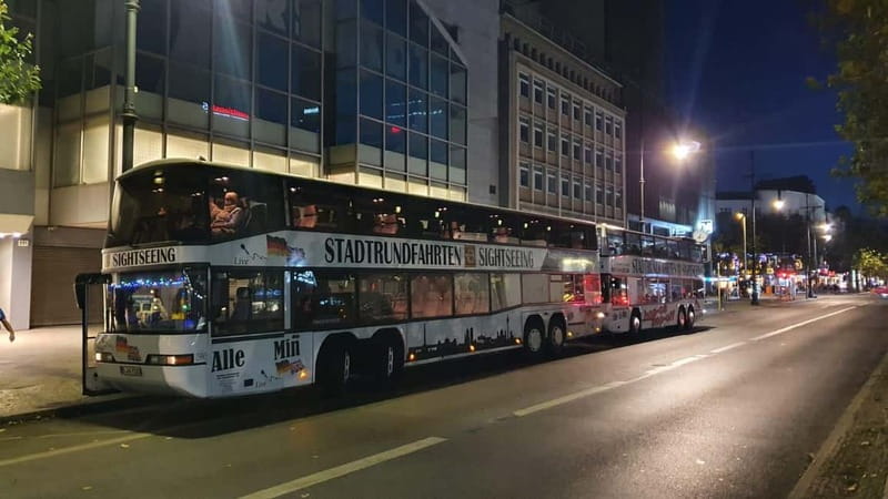 Berlin: Bus Tour by Night with Live Commentary - Berlin at night, paced like a moving light show