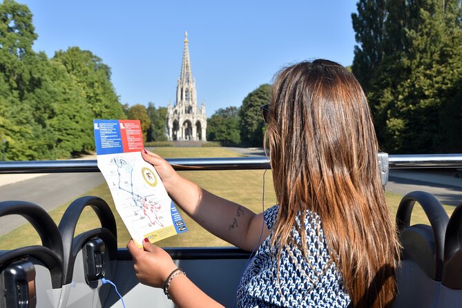 Brussels Tootbus Discovery Hop On Hop Off Bus and walking tours - Audio guide and headphones: multilingual narration that may not match perfectly