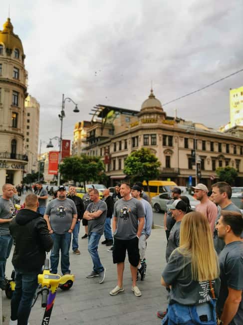 Bucharest city tour: Hop-on Hop-off sightseeing minibus - Revolution Square: quick outside stories that stick