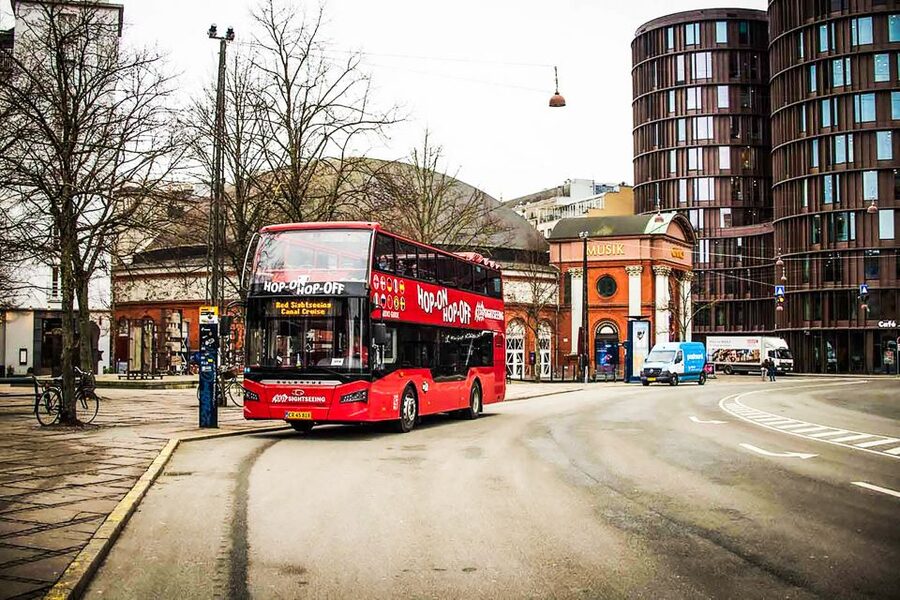 Copenhagen: Hop-On Hop-Off Bus Tour with Boat Tour Option - Double-decker comfort: open air views with audio in 10 languages