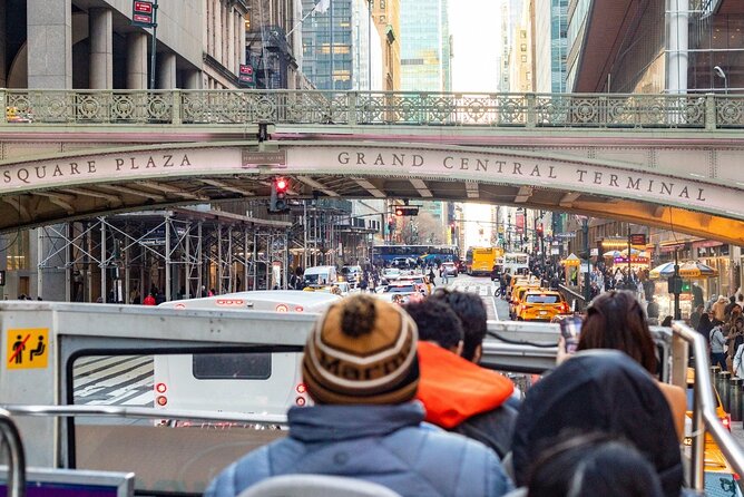 Express Sightseeing Bus Tour with Statue of Liberty Cruise Combo - Midtown hits: Times Square energy, NYPL lions, and the Flatiron angle