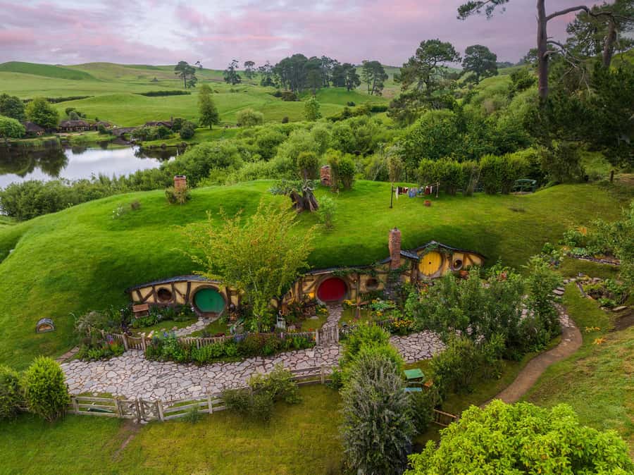 From Auckland: Waitomo & Hobbiton Bus Tour with Lunch - Waitomo Glowworm Caves: Limestone Tunnels and the Glowworm Grotto Boat