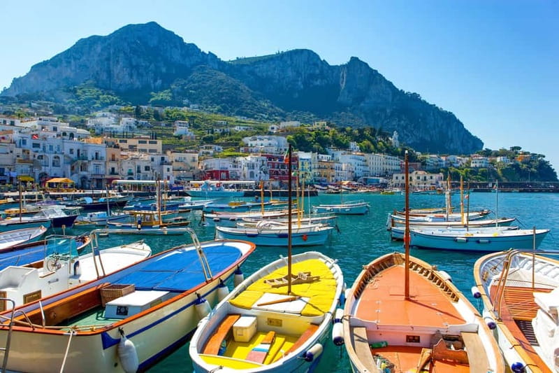From Naples: Complete Capri Guided Boat and Bus Tour - Capri Town on Foot: Piazzetta, Alleys, and the Augustus Gardens