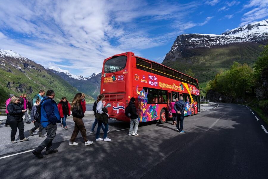 Geiranger: City Sightseeing Hop-On Hop-Off Bus Tour - Passing Hole on the way up: a reminder you’re driving the real fjord roads