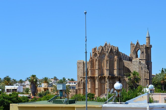 Ghost-Town Famagusta Mini Bus Tour from Protaras and Ayia Napa - Stop 3: Ghost Town Streets to the Golden Sand Shore