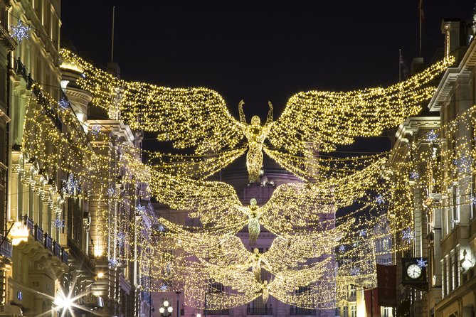 London by Night Bus Tour with Christmas Lights and Live Guide - The Strand: fairy lights, West End energy, and quick photo moments
