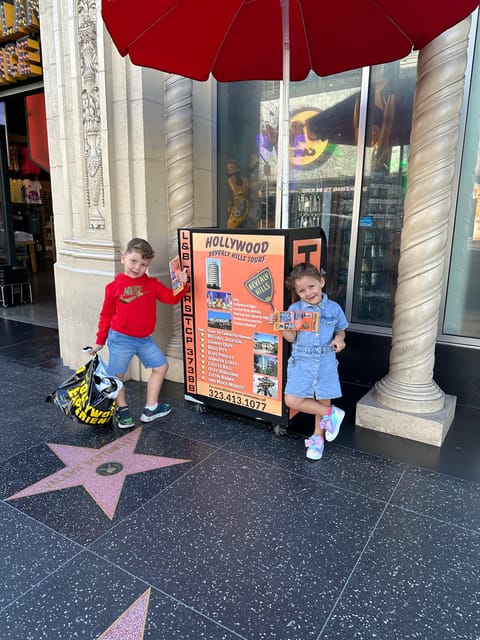 Los Angeles: Hollywood and Beverly Hills Open-Top Bus Tour - Meeting at Hollywood Blvd: find the red umbrella outside Hollywood Experience