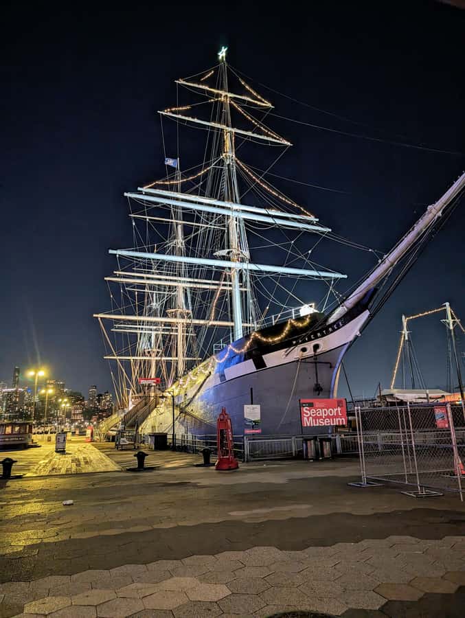 New York City: Guided Private Glass-Top Bus Tour at Night - Pier 17 and South Street Seaport views of Brooklyn Bridge