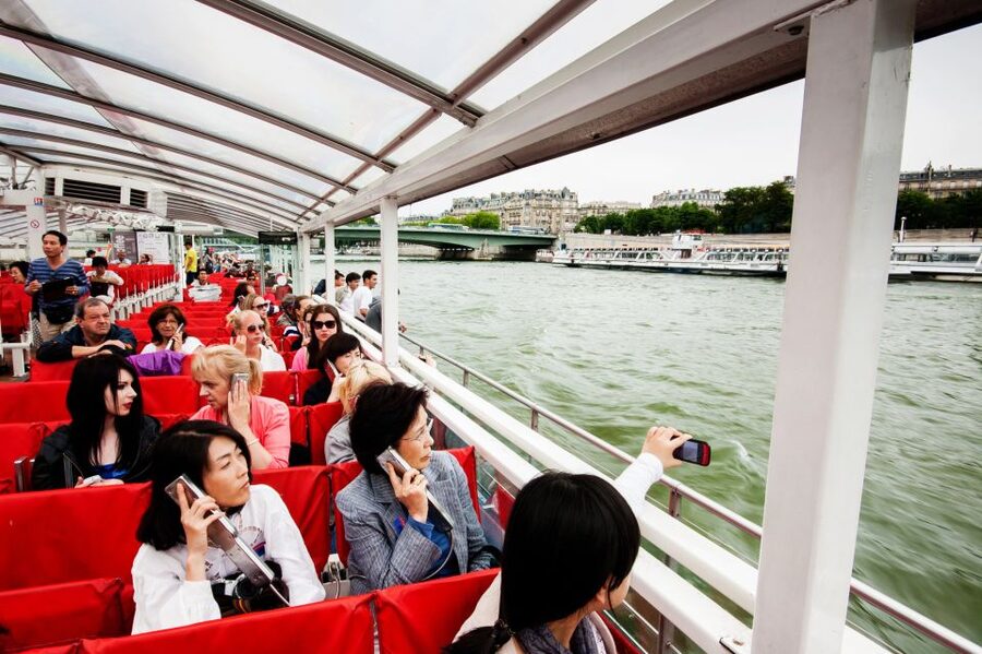 Paris: Audio-Guided Bus Tour & Seine River Cruise - Boarding the trimaran: the 1-hour Seine River cruise from the Eiffel Tower area