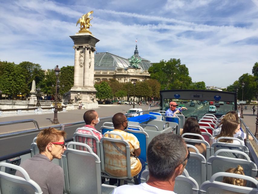 Paris: Discovery Hop-On Hop-Off and Paris by Night Tour - Audio guide setup: 10 languages, earphones, and kids tracks