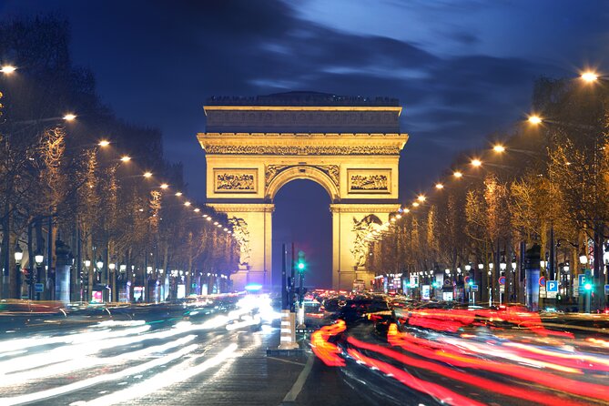 Paris Lights Evening Bus Tour with Eiffel Tower Summit Option - Champs-Élysées to Arc de Triomphe, then back toward Trocadéro