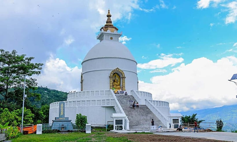 Pokhara: City Sightseeing Group Budget Bus Tour - Lakeside Pickup and the First Climb: Pumdikot Shiva Statue
