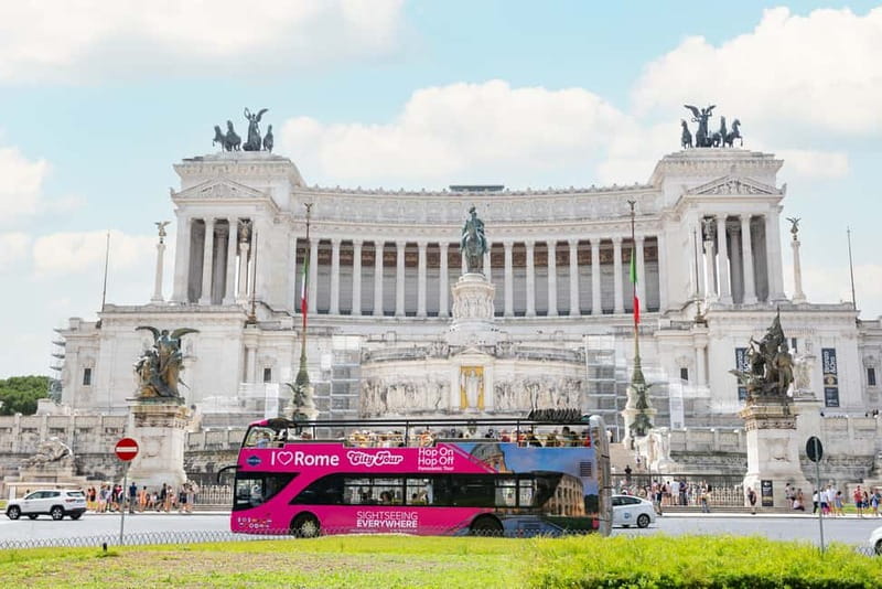 Rome: Hop-on Hop-off Sightseeing Bus Tour with Audioguide - The pink bus experience: top-deck views, detachable roof, and real comfort