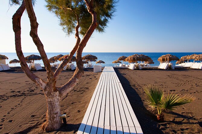 Santorini In One Day Bus Tour with Oia Sunset & optional Sailing - Stop 4: Perissa black sand beach—swim, snack, and shop time