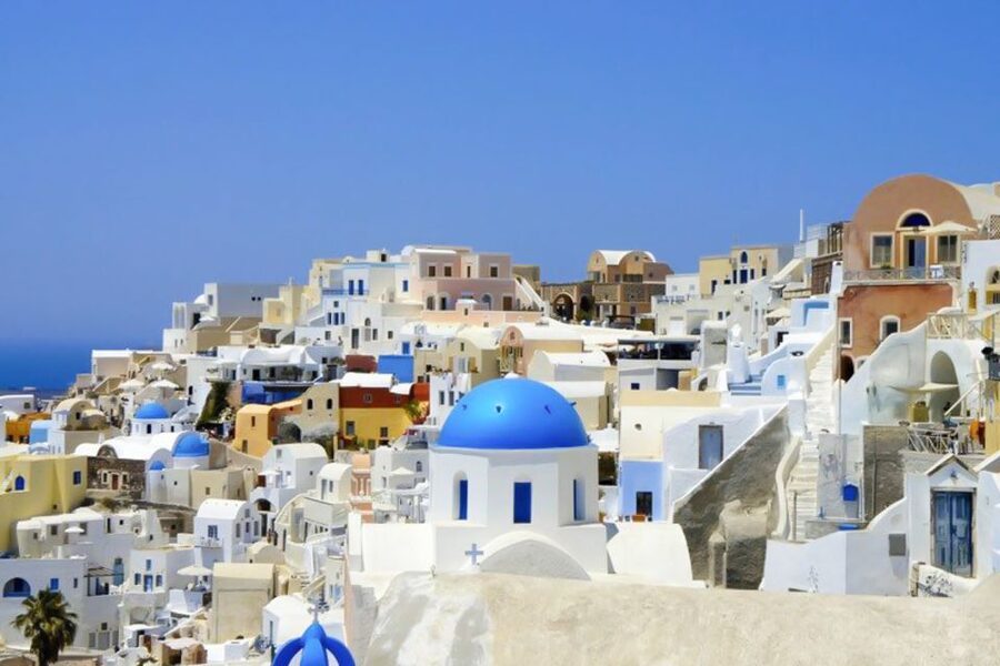 Santorini Island Bus Tour and Caldera Sunset Cruise - Pyrgos village time: Cycladic charm and a fortress vibe