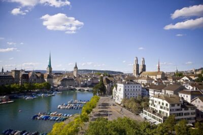 Zurich: Sightseeing Bus Tour with Optional FIFA Museum - Züri Leu and quick photo stops that set the tone